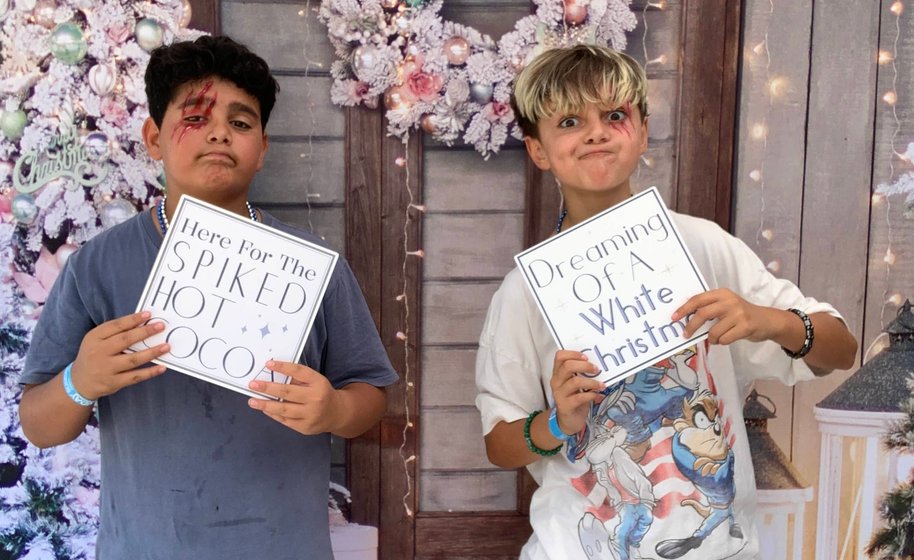 Newlyweds posing outside with friends
